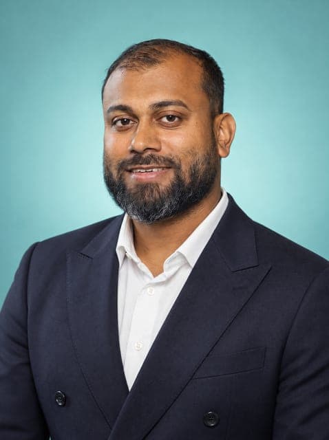 Professional portrait in a double-breasted navy suit