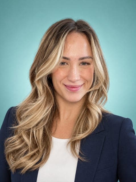 Team headshot in a black blazer